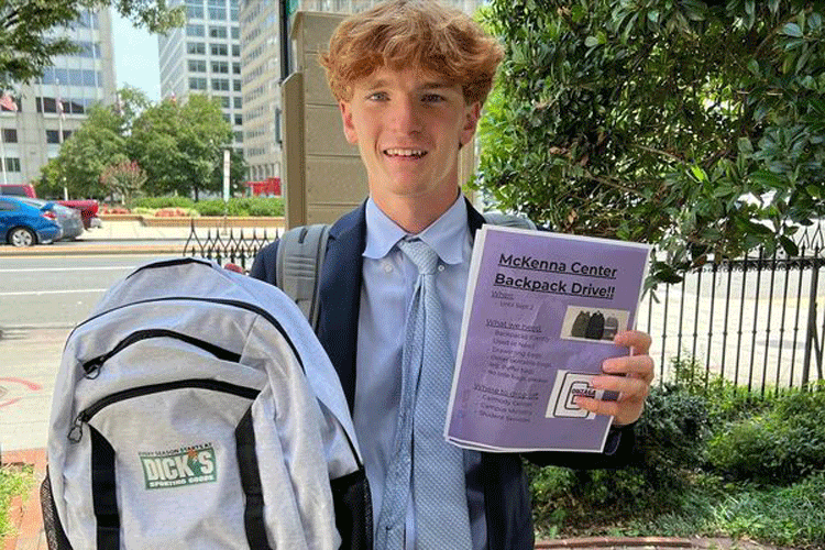 Lucas delivering the first backpack received from the drive.